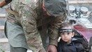 A disturbing photo from one of the articles published in ISIL's latest propaganda magazine, 'Rumiyah', shows a father teaching his son how to hold a weapon. Children in ISIL areas are being indoctrinated to form the next generation of fighters.