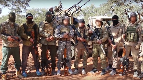 A screenshot from a YouTube video posted last December shows Kyrgyz militants somewhere in Syria. Kyrgyz authorities have identified college graduates among Kyrgyz citizens fighting in Syria.