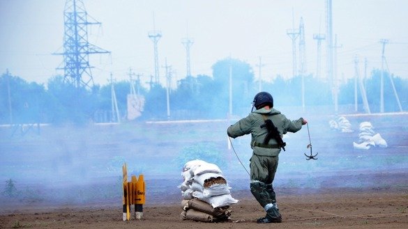 "The primary goals of the [training] were to study explosives and ways to destroy them, how to clear an area and buildings of bombs, and how to clean up after fires and explosions at munitions depots," said the Kazakhstani Defence Ministry. A sapper is shown at the Bereg training ground August 22. [Kazakhstani Defence Ministry]