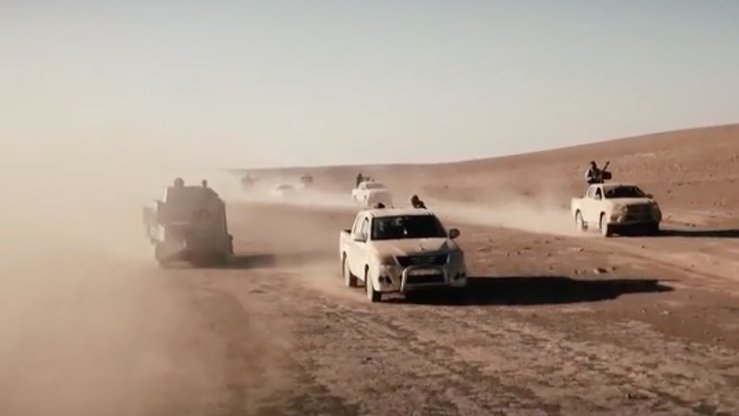 Screen shot from the 'Flames of War II' video from ISIS, using old footage of fighters driving across the group's so-called 'caliphate' before it collapsed this year.