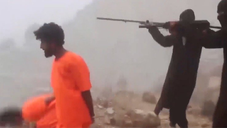 A screenshot from an 'Islamic State' video released March 4 shows group members gunning down defenceless civilians.