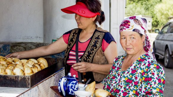 The Dadabayev family, pictured here, owns a small road café near the Kyrgyz-Tajik border. "There will be many tourists, if the road is good," said Ms. Dadabayeva. [World Bank Group]
