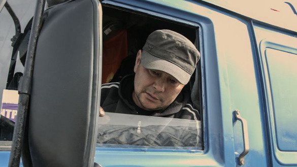 Asangodjayev, a Kyrgyz truck driver, appreciates the modern technology, like the axle load control, being used on the new roads. "It's good that the scale is automatic. We pass very quickly, without delay, in less than five minutes," he said. [World Bank Group]
