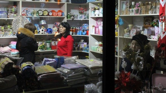 In a small shop in Astana, a mother and son choose gifts on December 25, ahead of the New Year. Shoppers are busy buying New Year's gifts for relatives, friends and co-workers in the remaining days of 2018. [Aydar Ashimov]