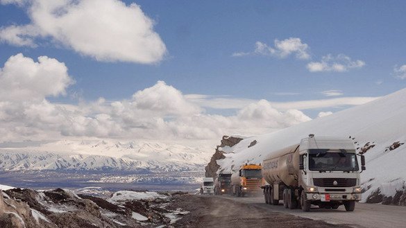 Fuel trucks ascend Anzob Pass in Tajikistan. [Christina Stuhlberger/Zoï Environment Network]