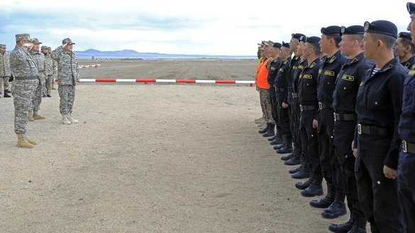 Kazakh Defence Minister Nurlan Yermekbayev greets soldiers at the Mailino training ground in East Kazakhstan Province in April. [Kazakh Defence Ministry]