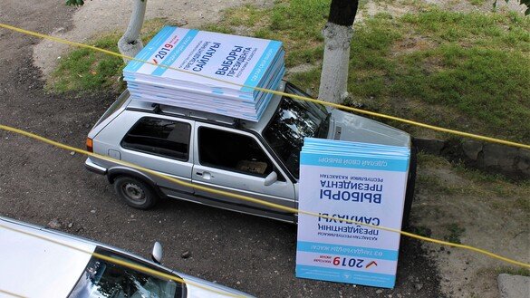 A car carrying signs for polling stations can be seen in Taraz on May 18. [Aydar Ashimov]