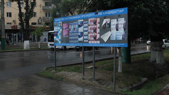 A billboard with election posters can be seen in Taraz on June 8. [Aydar Ashimov]