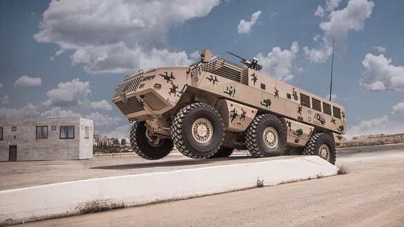 A wheeled armoured vehicle manufactured by Kazakhstan Paramount Engineering plant is demonstrated at the KADEX-2018 arms show in Nur-Sultan in May 2018. [Kazakhstan Paramount Engineering]