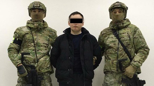 A man accused of plotting a terrorist act was arrested March 25. He is shown in custody. [Kazakh National Security Committee (KNB)]