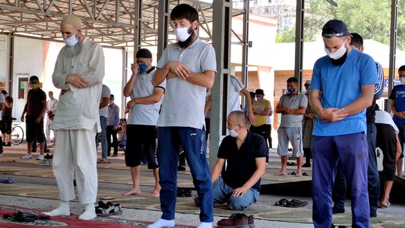 Muslims wearing masks and socially distancing worship at the Bishkek Central Mosque July 13. [Maksat Osmonaliyev]