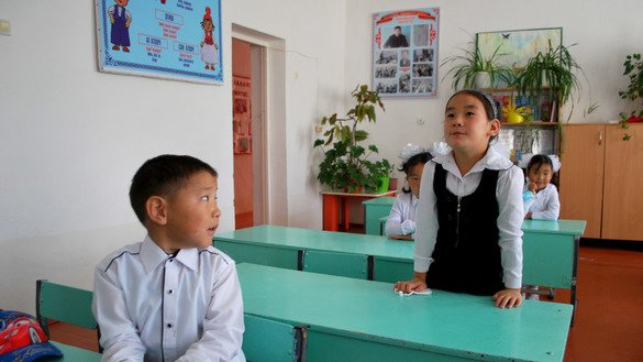 A pupil introduces herself to the teacher and her classmates. September 1, K. Ibraimaliyev School, Kurpuldok village, Panfilov District, Chui Province. [Maksat Osmonaliyev]