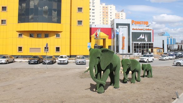 Modern sculptures, such as this family of green elephants, decorate the capital. [Aydar Ashimov]