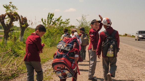 Children head to school in Kyrgyzstan. [Christina Stuhlberger/Zoï Environment Network]