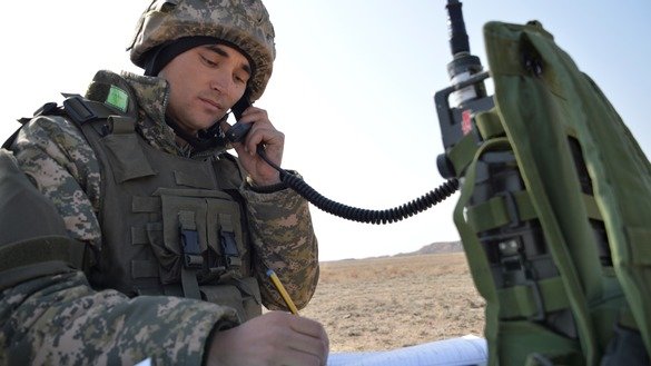 A signal operator transmits intelligence information to headquarters during an exercise in Almaty Province March 16. [Kazakh Ministry of Defence]