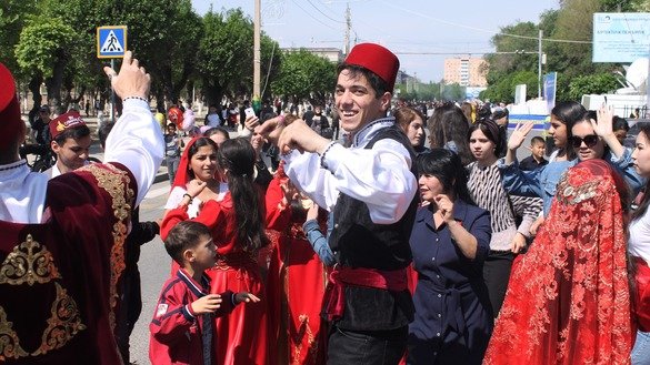 Representatives of the Turkish diaspora perform a fire dance May 1 in Taraz for People's Unity Day. [Aydar Ashimov]
