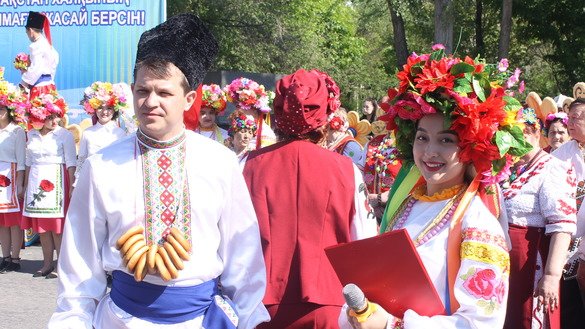 Young men and women can be seen wearing Ukrainian folk costumes May 1 in Taraz. [Aydar Ashimov]