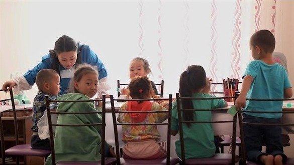 Children who returned from Syria to Kazakhstan have lunch at a rehabilitation centre in Mangystau Province, Kazakhstan. The screenshot is from a KNB video.