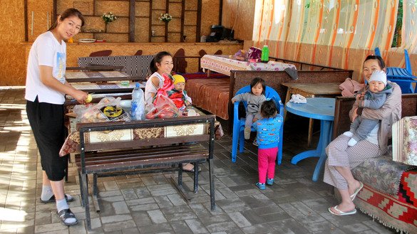 Guests from Karakol make their lunch at the Relax guesthouse, which has been relatively empty compared with past years. Cholpon-Ata, Issyk-Kul Province, July 24. [Maksat Osmonaliyev]