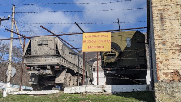 Military vehicles are seen inside a restricted area near the Russian military base in Kiziltash in a photograph taken March 5. [Yevgenij Gordienko/Caravanserai]