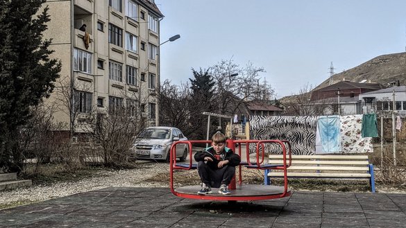 Life in Koktebel is reflected in an apartment building's courtyard, seen here February 26. Children attend classes, even amid the global coronavirus pandemic. After school, the poorly equipped playgrounds see little activity. [Yevgenij Gordienko/Caravanserai]